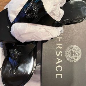 Brand new! Versace Black pool sandals. Will fit someone that is a size 8-8.5.
